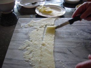 Cutting up the dough.
