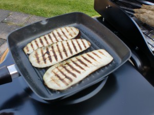 Aubergine slices on the griddle.